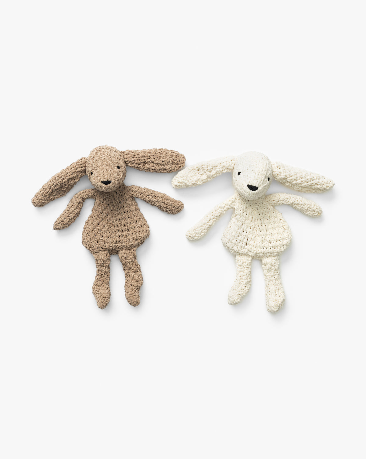The Chenille Bunnies (Set of 2) features ultra-soft knit plushies in brown and cream, each with long ears, round eyes, and stitched smiles—ideal for cozy nursery decor, by McGee & Co.