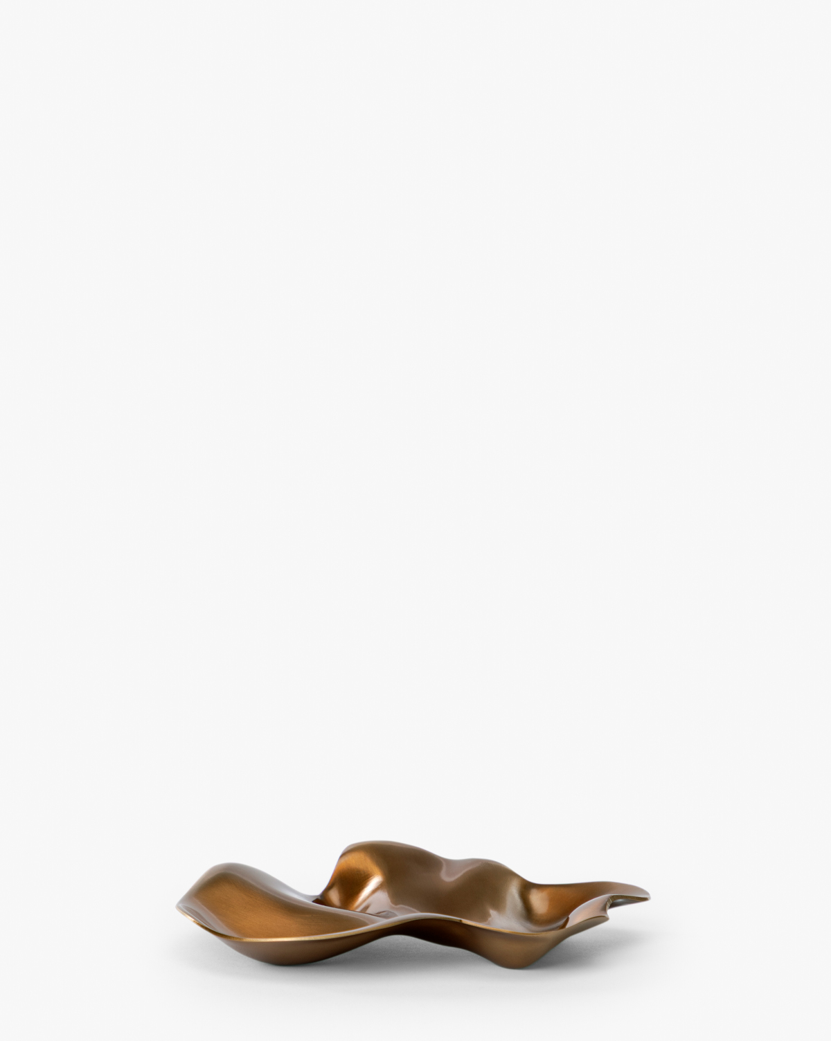 The Chiffonner Metal Object, featuring a wavy, bronze-colored form with a metallic finish and irregular shape, exemplifies modern artistry against a plain white backdrop, by McGee & Co.