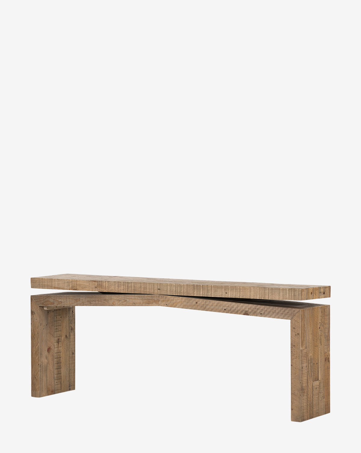 The Colter Console Table is a minimalist wooden piece made from reclaimed wood, featuring an angular, asymmetrical design and a natural finish, shown against a plain white background by McGee & Co.
