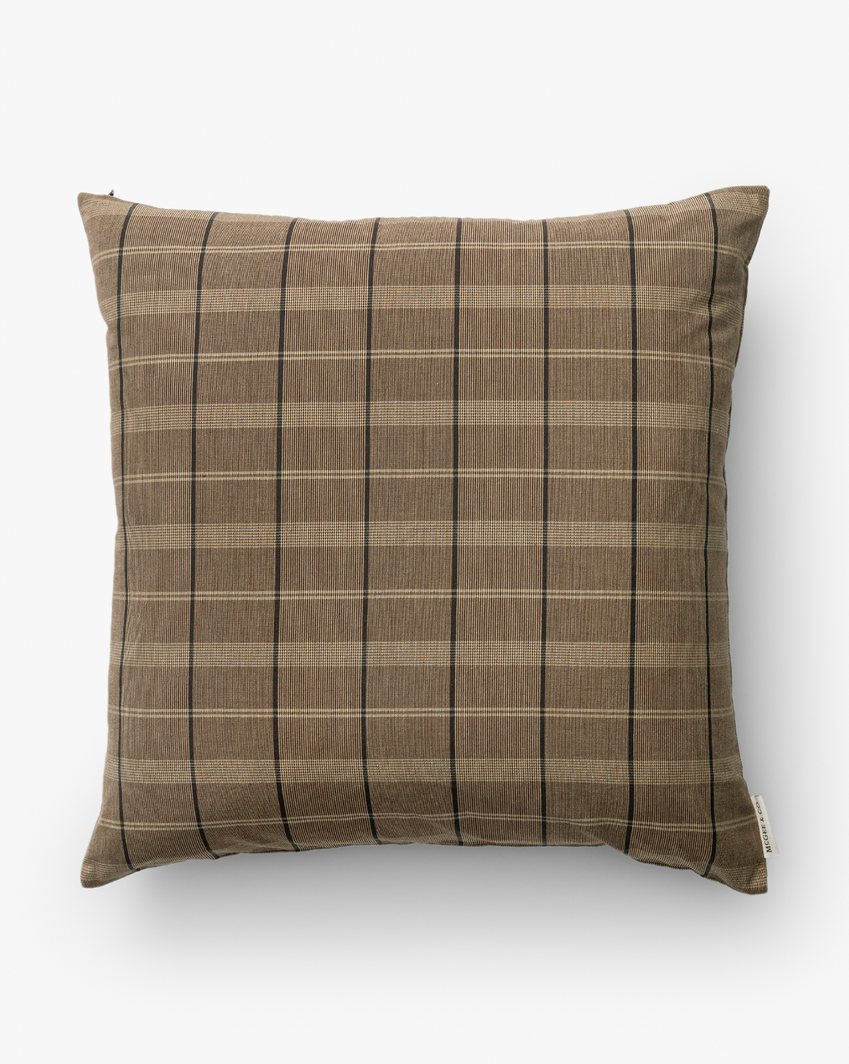 The Curtis Pillow Cover features a brown and beige plaid design with thin black lines, a visible fabric tag on the lower right edge, and adds a neutral touch to your space, by McGee & Co.
