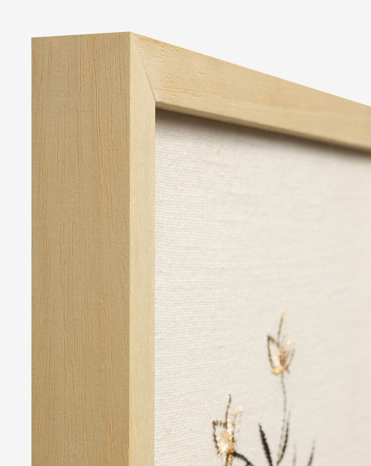 Close-up of the Embroidered Pixie Flowers, a light wood-framed canvas with embroidered flowers on cream fabric—ideal as cotton wall decor to bring botanical charm to your space by McGee & Co.