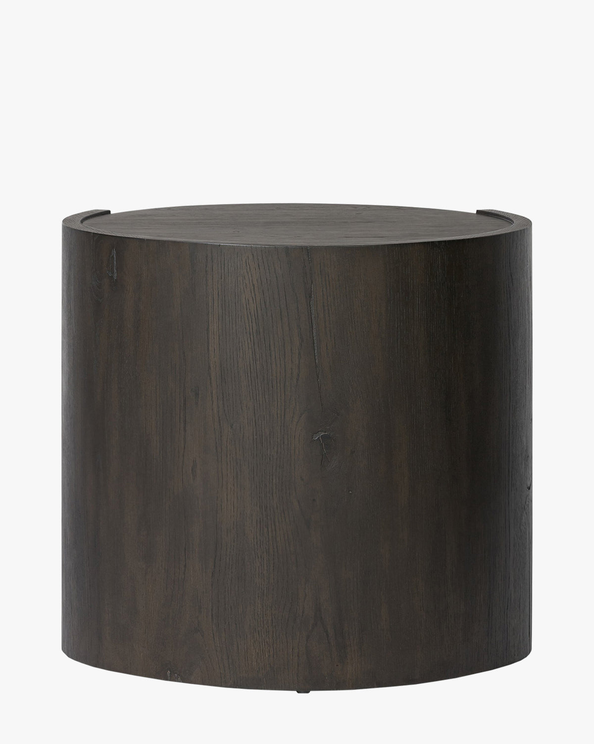The Glenndon Oak Nightstand features a round silhouette, black finish, smooth surface, and natural wood grain texture, shown against a plain white background by McGee & Co.