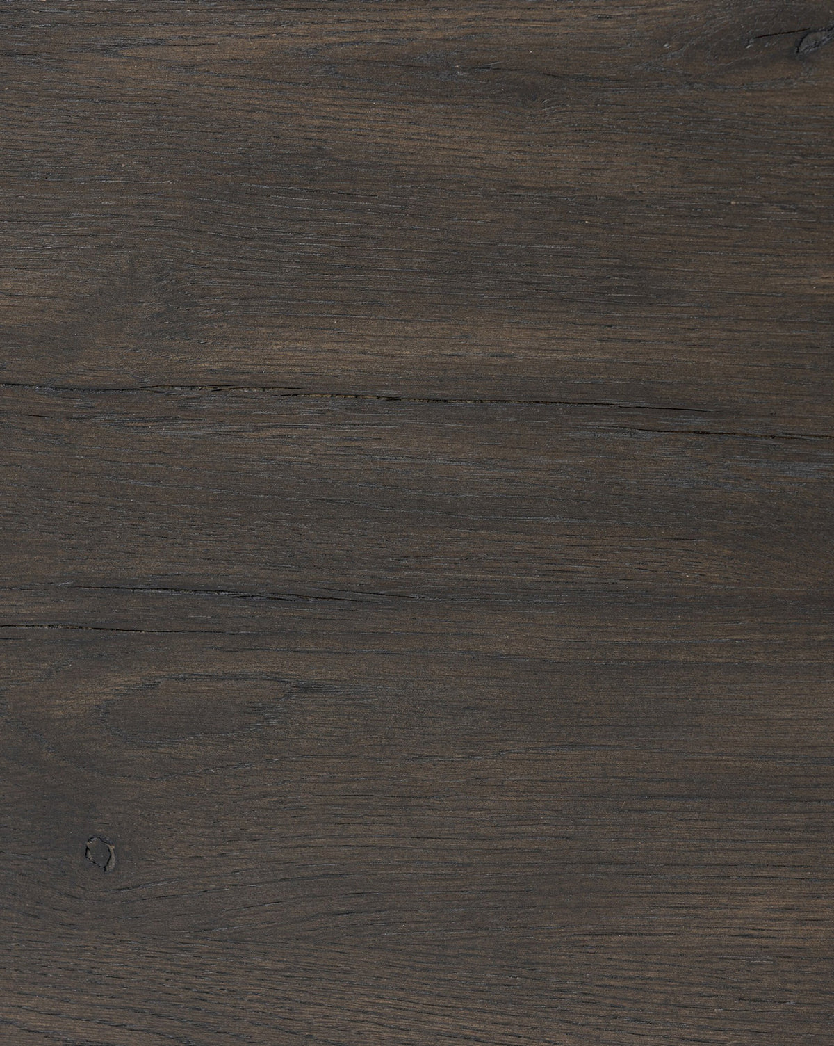 The Glenndon Oak Nightstand features a dark brown wooden surface with visible grain patterns, subtle knots, and horizontal lines, capturing the natural textured look of black-finished oak, by McGee & Co.