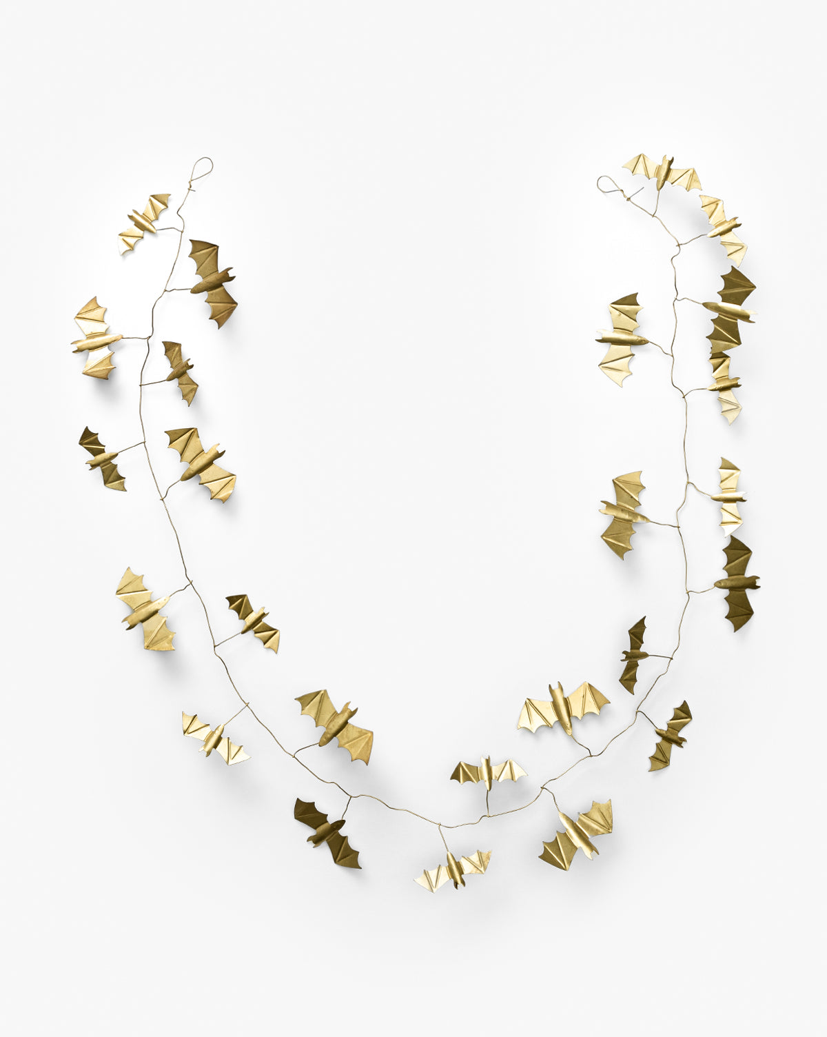 The Gold Metal Bats Garland 72 features gold-colored, origami-style metal bats strung along a thin wire and displayed in a U-shape against a white background—ideal for adding elegant Halloween décor to your space, by McGee & Co.