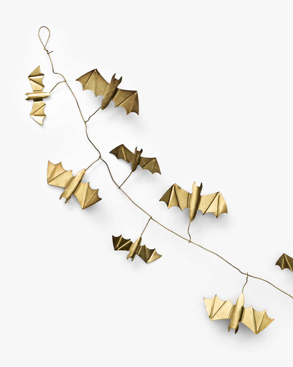 The Gold Metal Bats Garland 72 features several gold-finished bats on a thin, twisted wire, making it perfect for Halloween décor and beautifully displayed against a plain white background, by McGee & Co.