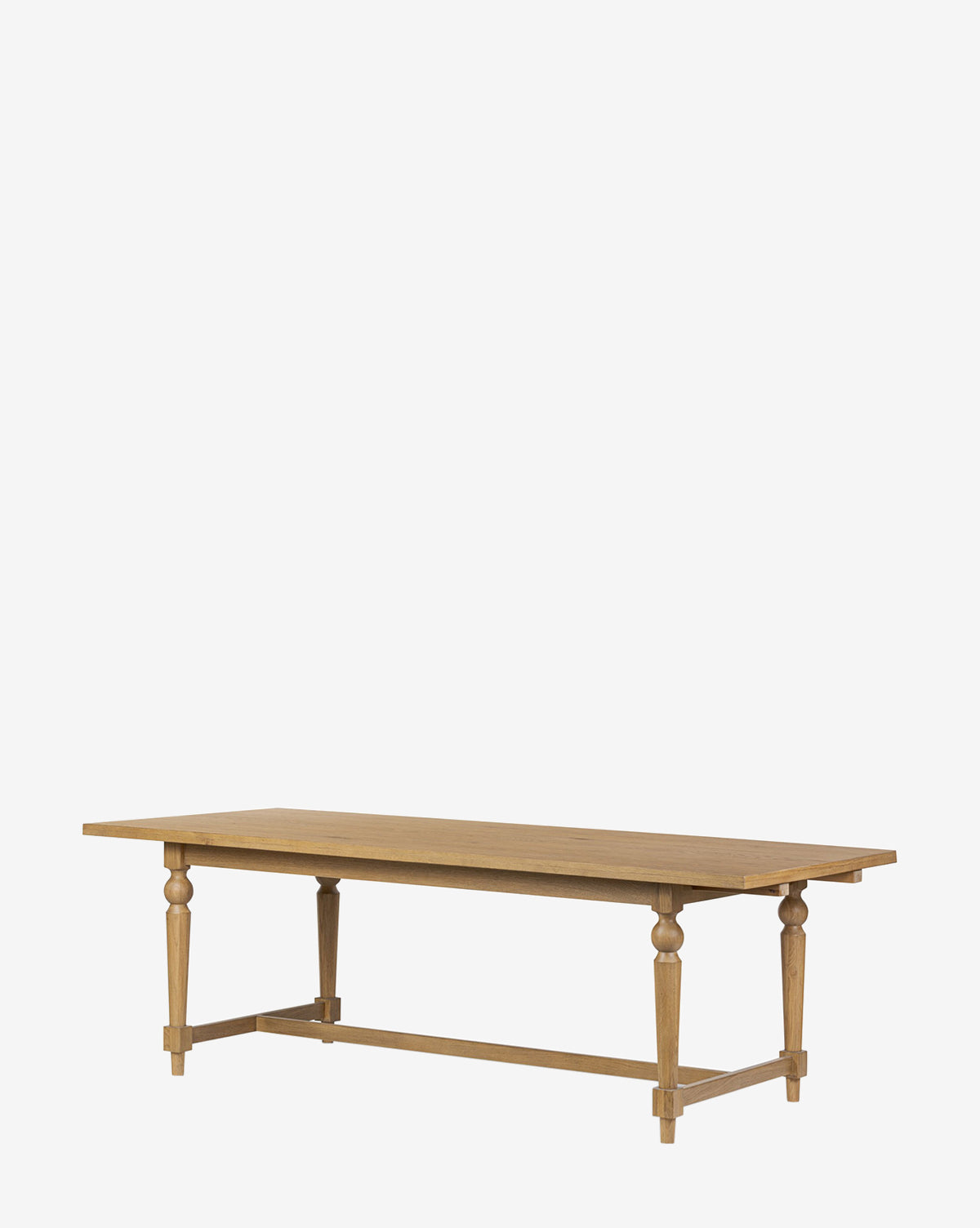 The Kyler Oak Extension Dining Table features a rectangular Scandinavian modern design with a smooth top and four turned legs joined by a horizontal support beam, shown against a plain white background, by McGee & Co.