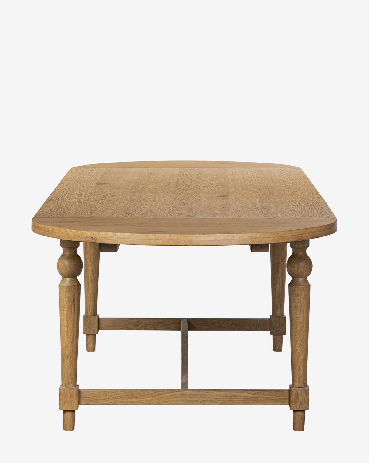 The Kyler Oak Extension Dining Table features a Scandinavian modern design with a wooden rectangular top, rounded corners, and carved legs, displayed front-facing against a plain white background by McGee & Co.