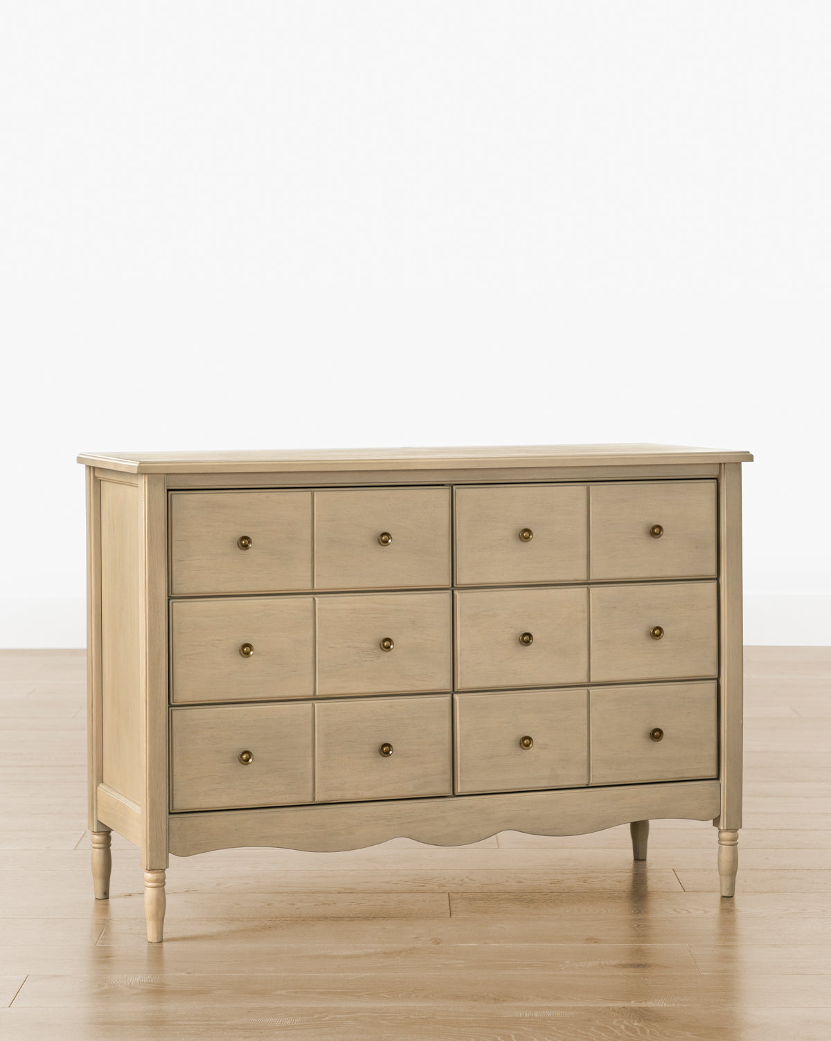 The Liberty 6-Drawer Assembled Dresser is crafted from sustainable pine wood with six spacious drawers and simple round knobs. Its timeless design stands on four tapered legs, blending eco-friendly style with classic functionality by McGee & Co.