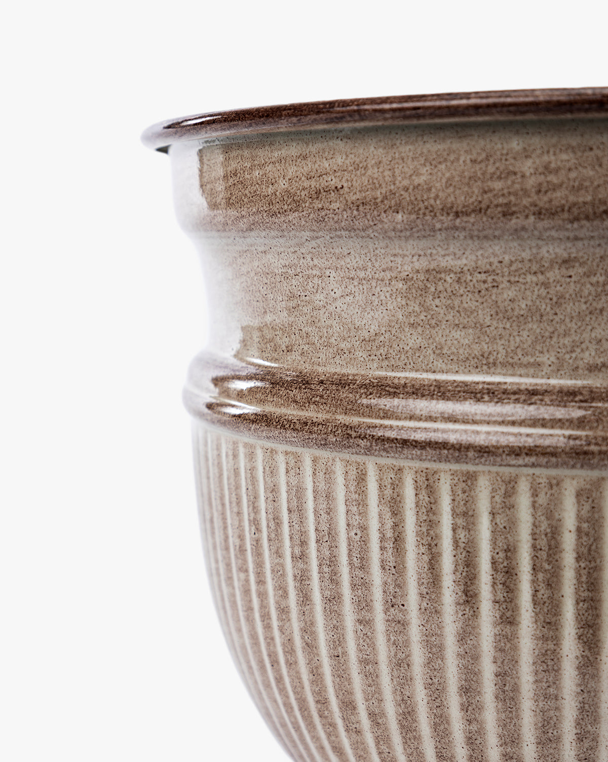 Close-up of the upper portion of a ribbed, light brown Lichfield Planters ceramic pot (Set of 3) with a glossy finish, highlighting detailed texture and curvature—ideal as stylish, weather-resistant outdoor planters by McGee & Co.