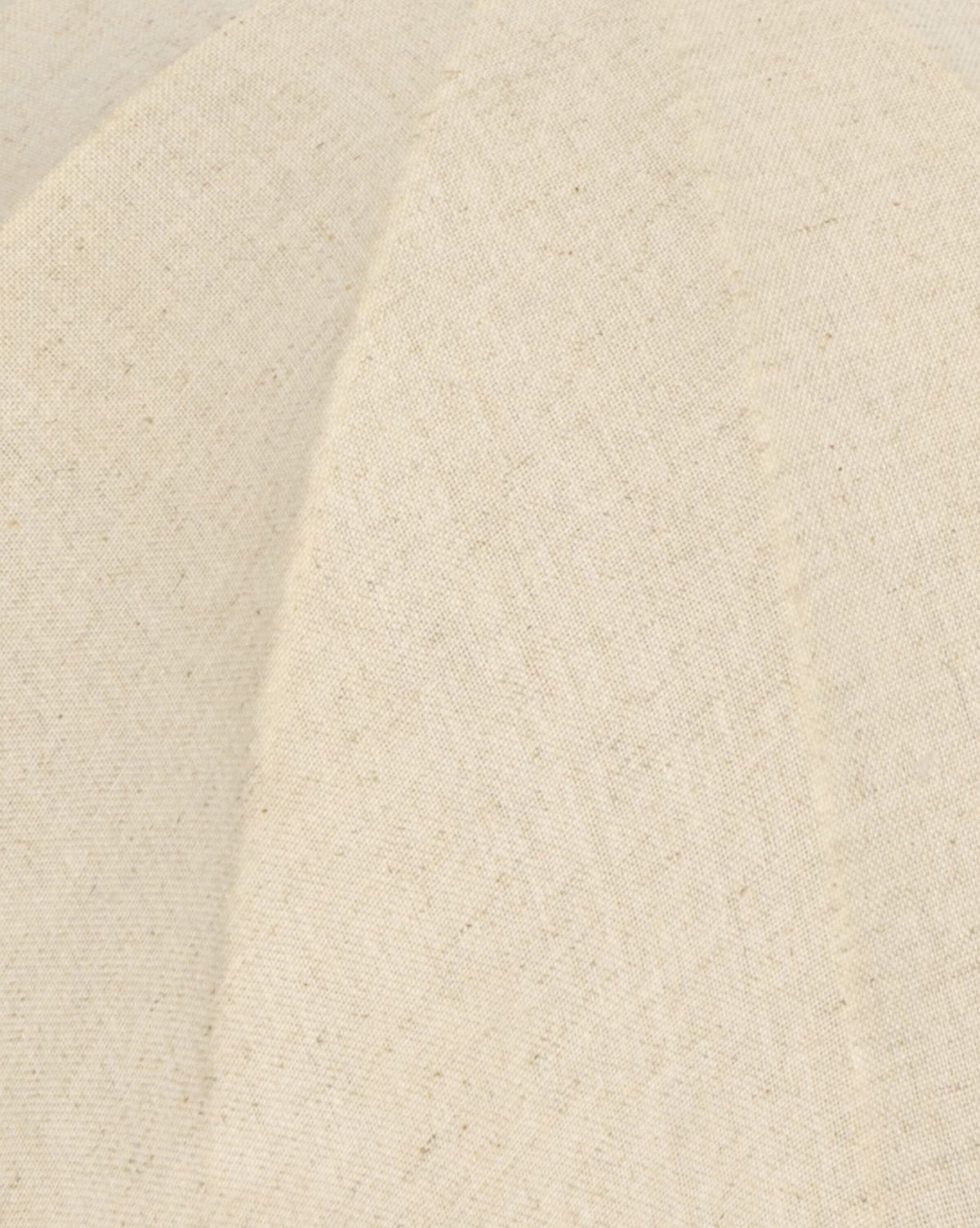 A close-up of the Malinska Table Lamp’s linen dome shade shows beige woven fabric with visible stitching and diagonal seams, creating elegant panels and a smooth textured surface to complement its Italian marble base, by McGee & Co.