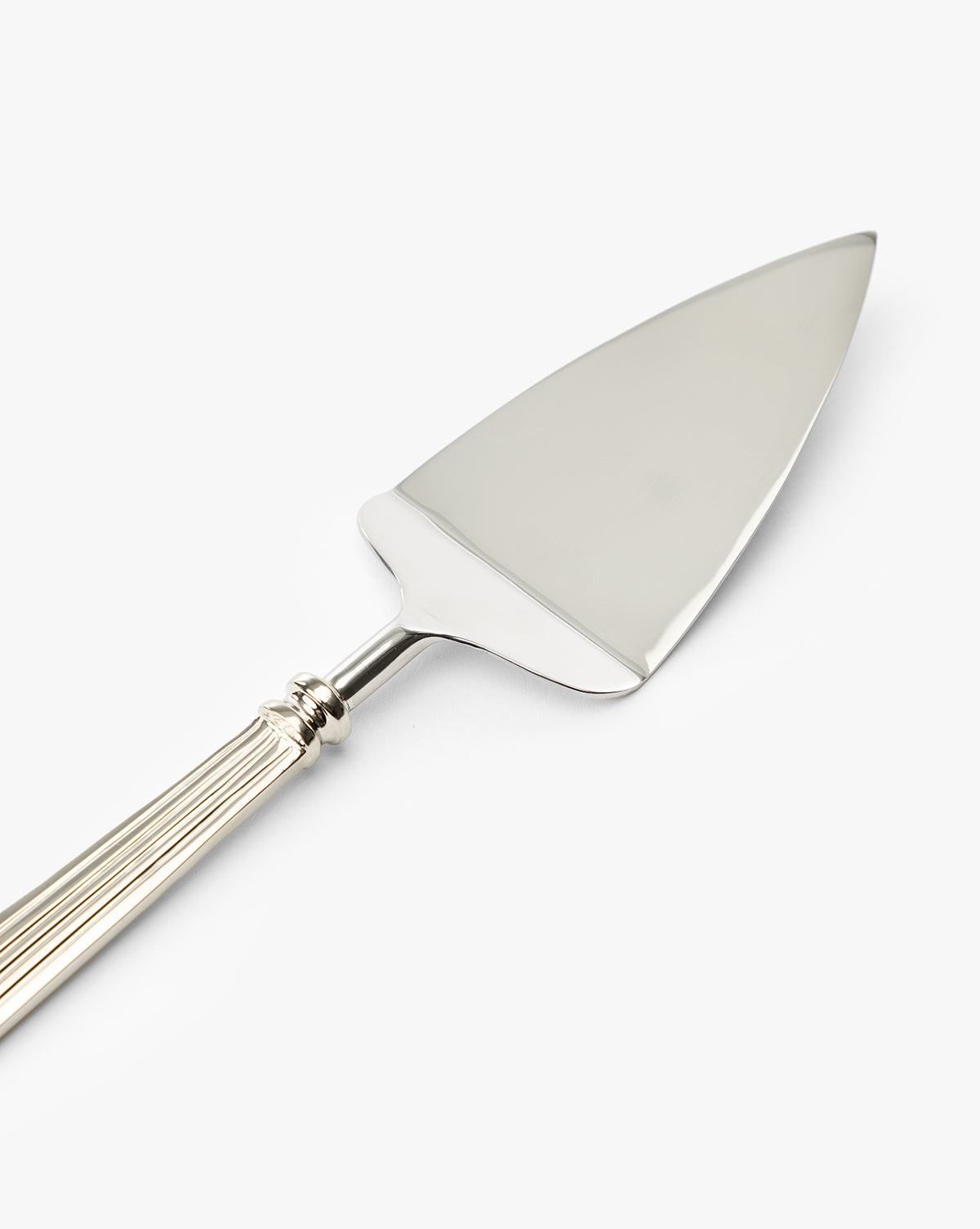 The McNully Pie Server is a silver dessert server with a flat, triangular blade and a decorative ridged handle, shown on a white background by McGee & Co.