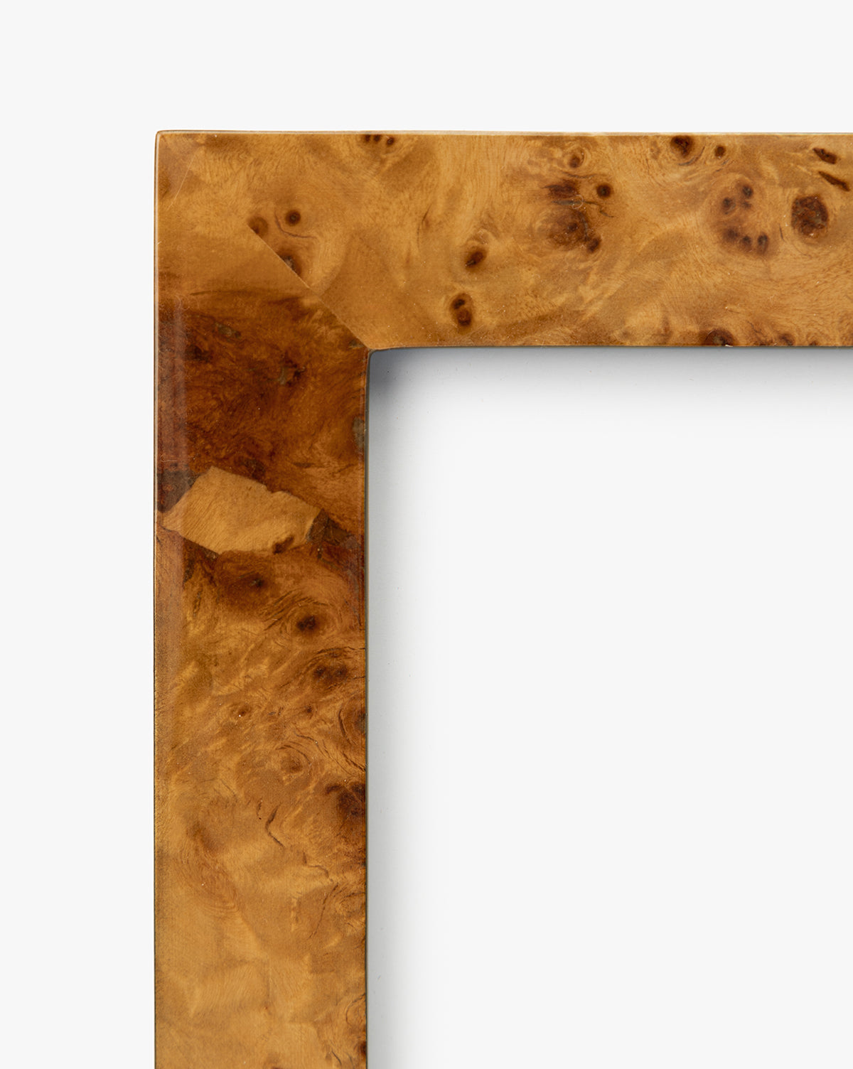 Close-up of the Oliver Burl 8x10 Frames (Set of 2), featuring a rectangular burl wood design with a high-gloss lacquer finish and swirling grain pattern—an elegant accent for any home décor, by McGee & Co.
