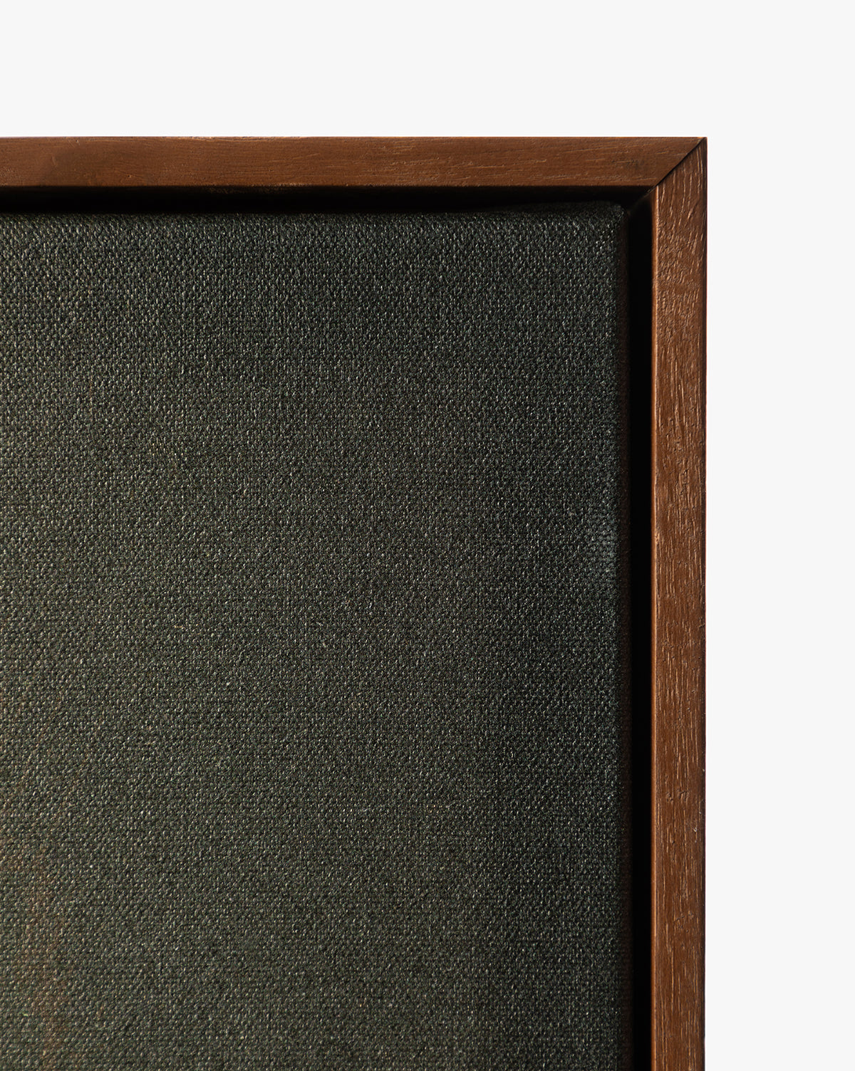 Close-up of the corner of Painters Depths, a gallery-wrapped, dark textured canvas in a wooden frame against a white background—ideal for displaying striking abstract wall art by McGee & Co.