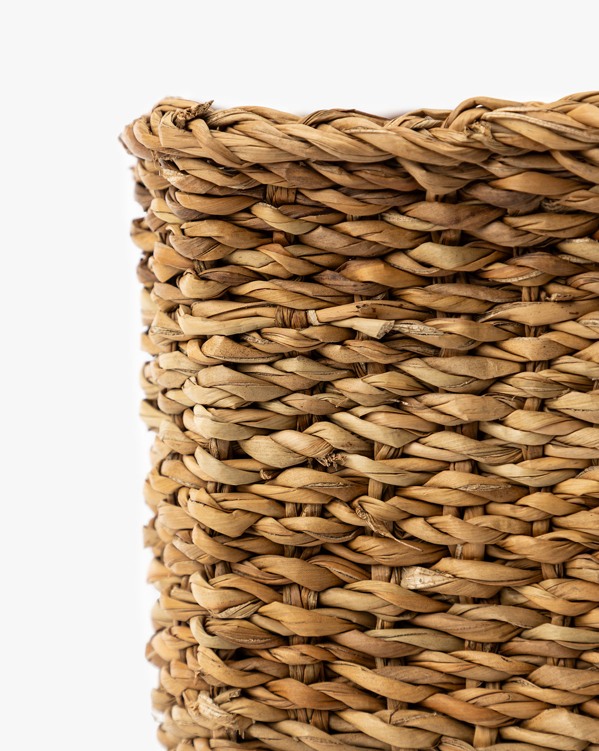 Close-up view of the Piers Baskets (Set of 3), highlighting the detailed texture and woven pattern of their natural fibers against a white background, by McGee & Co.