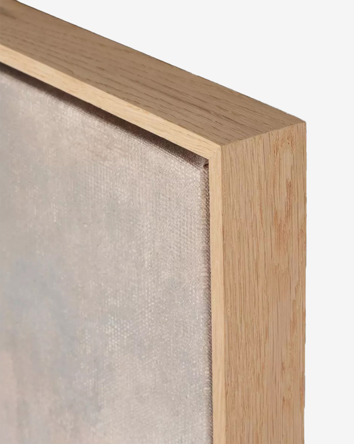 Close-up of the corner of Seeing in Color by Aileen Fitzgerald, a stretched canvas artwork with a light white oak frame. The canvas texture, detailed brushwork, and subtle wood grain appear vividly against a plain white background, by McGee & Co.