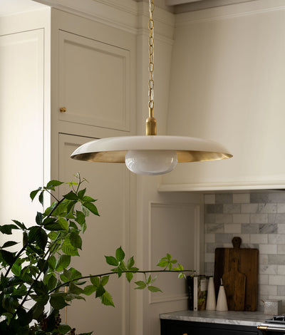 Pendant lighting fixture hanging in a stylish kitchen.
