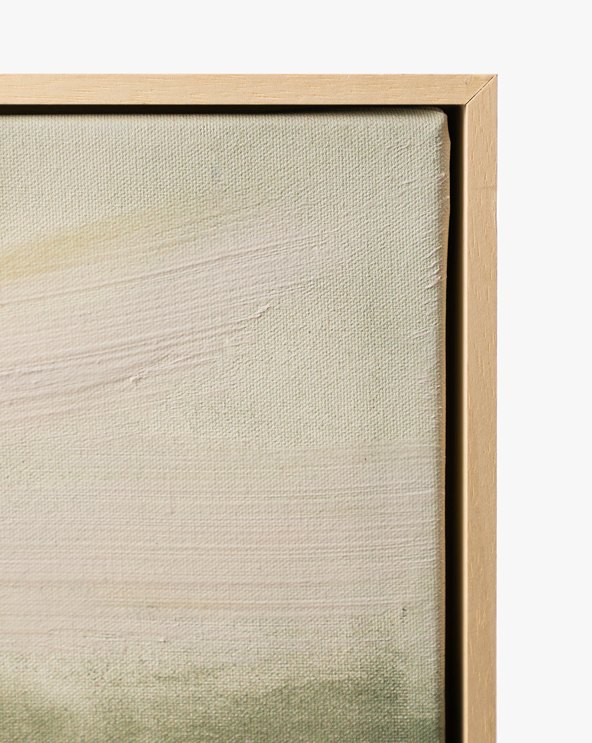 Close-up of Stormy Sky Afternoon, a gallery-wrapped canvas with textured brushstrokes in soft cream and green tones, finished with a light wood frame—an elegant piece of framed wall art for any space, by McGee & Co.