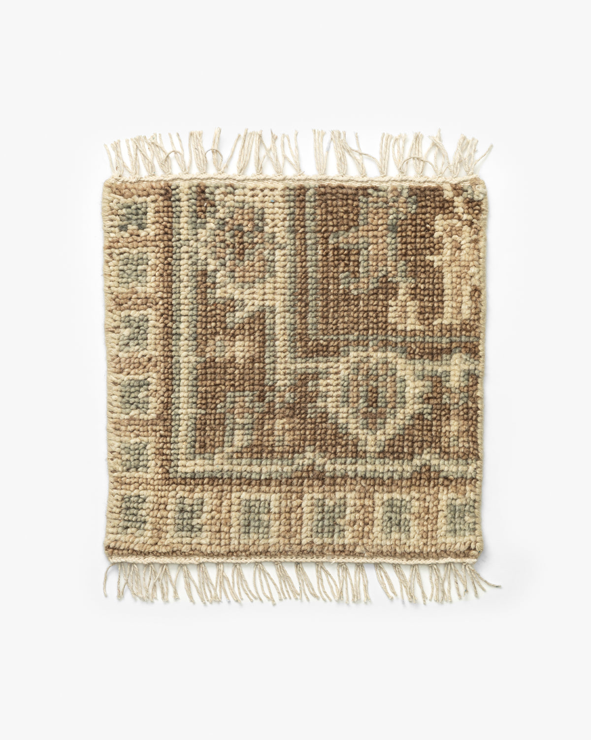 Wayland Hand-Knotted Wool Rug Swatch: a small rectangular wool sample with beige, brown, and light blue geometric patterns and short fringe on both shorter edges, shown on a white background by McGee & Co.