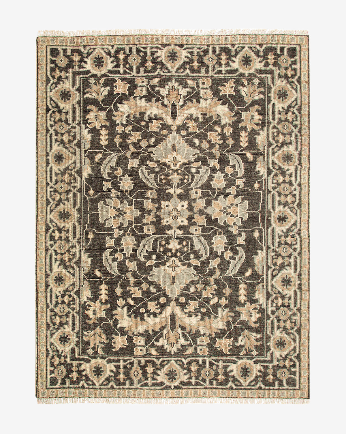 The Wayland Hand-Knotted Wool Rug is a rectangular artisan piece with an intricate floral and geometric pattern in beige and cream on a dark brown background, all framed by a detailed decorative border, by McGee & Co.